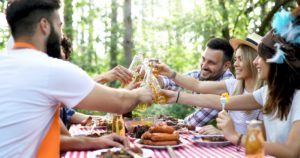 Friends having a barbecue party in nature