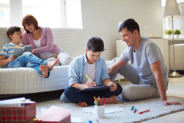 Family at leisure Portrait of friendly family spending leisure together at home