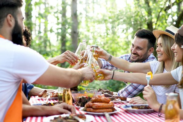 Friends having a barbecue party in nature